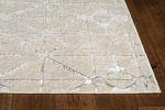 5' X 8' Ivory And Brown Geometric Area Rug