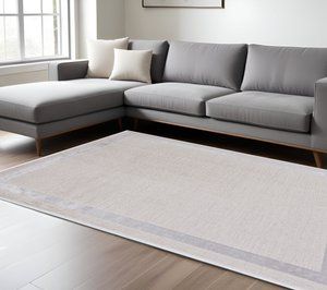 7' X 10' Ivory And Silver Abstract Area Rug