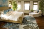8' X 10' Brown Blue And Green Wool Tropical Botanical Hand Tufted Area Rug