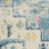 7' X 10' Ivory And Turquoise Oriental Distressed Area Rug