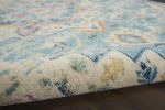 7' X 10' Ivory And Turquoise Oriental Distressed Area Rug