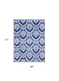 4' X 6' Blue And Ivory Damask Distressed Area Rug