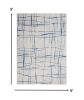 6' X 9' Ivory And Blue Geometric Distressed Area Rug