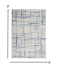 6' X 9' Ivory And Blue Geometric Distressed Area Rug